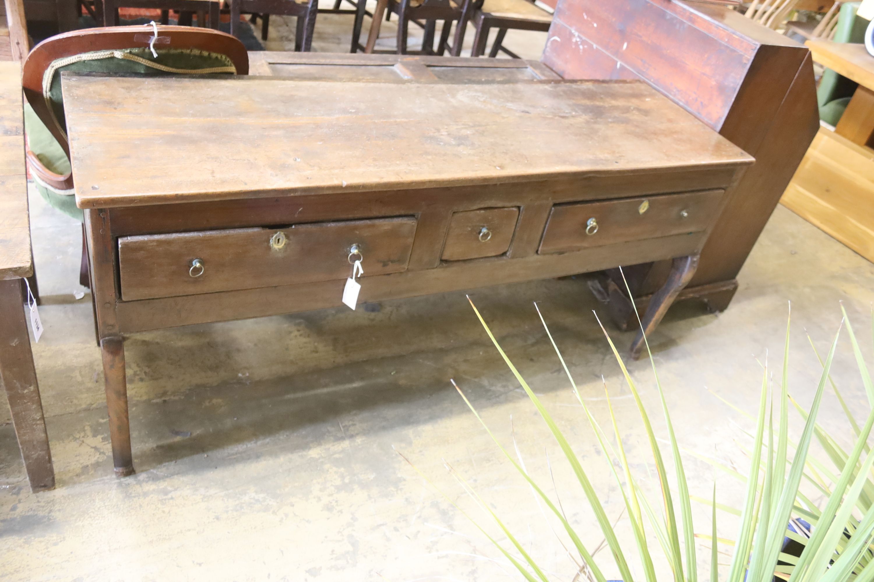 An early 18th century oak low dresser, length 165cm, depth 53cm, height 78cm